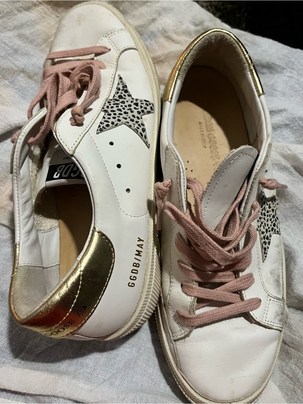 Golden Goose White Leather Sneakers with Pink Laces and Gold Accents.